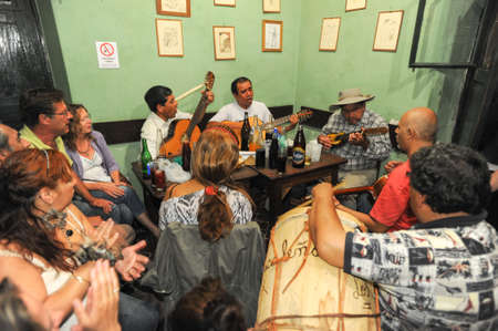 Salta, Argentina - 21 February 2011 People listening at a music entertainment at the bar of La Casona on Salta, Argentinaのeditorial素材