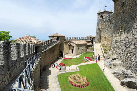 Borgo Maggiore, San Marino - 4 July 2014: Tourists visiting La Rocca fortless on Borgo Maggiore, San Marinoのeditorial素材