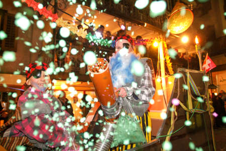 Engelberg, Switzerland - 17 February 2007: people shooting confetti during the celebration of Carnival at Engelberg on the Swiss alpsのeditorial素材