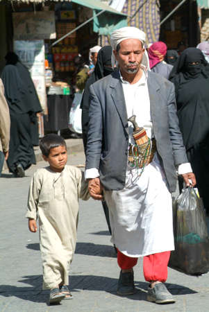 Sana, Yemen - 20 January 2008: Man with a boy on traditional clothes at Sana on Yemenのeditorial素材