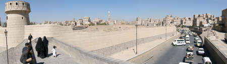 Sana, Yemen - 23 January 2008: people walking on the bridge near old Sana on Yemenのeditorial素材