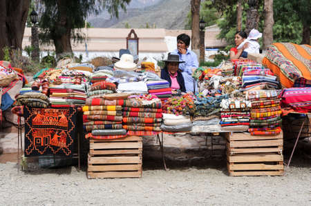 PURMAMARCA, ARGENTINA - 27 January 2011: indian people selling traditional crafts at the market of Purmamarca, province Jujuy, northen Argentinaのeditorial素材