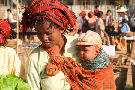 Indein, Myanmar - 15 January 2010: people on traditional clothes at the weekly market at Indein on Inle Lake in Myanmarのeditorial素材