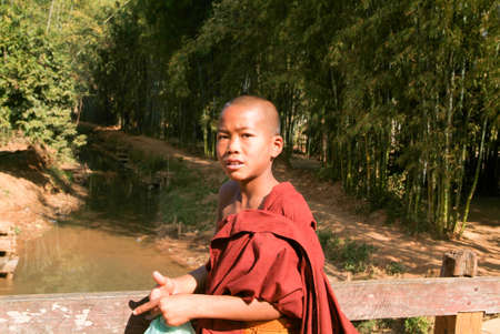 Indein, Myanmar - 15 January 2010: Young monk at the weekly market at Indein on Inle Lake in Myanmarのeditorial素材