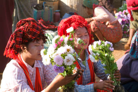 Indein, Myanmar - 15 January 2010: people on traditional clothes at the weekly market at Indein on Inle Lake in Myanmarのeditorial素材