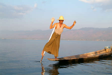 Lake Inle, Myanmar - 15 January 2010: Fishermen fishing on his boat at lake Inle, Myanmarのeditorial素材