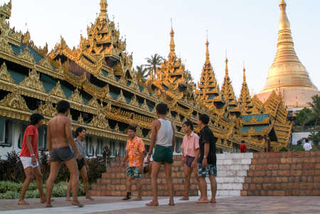 Yangon, Myanmar - 9 January 2010: People playing with a ball in the area of the Shwedagon Pagoda in Yangon on Myanmarのeditorial素材