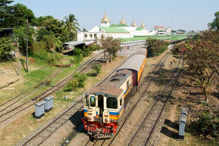 YANGON, MYANMAR - 9 Januray 2010 - A Circular Railway Train leaves Yangon Central Railway Station in Yangon (Rangoon) on Myanmar. Yangon Circular Railway is the local commuter rail network.のeditorial素材