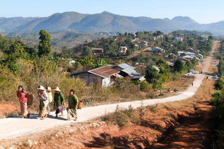 Kalaw, Myanmar - 12 January 2010: People walking out of the village of Kalaw on Myanmarのeditorial素材