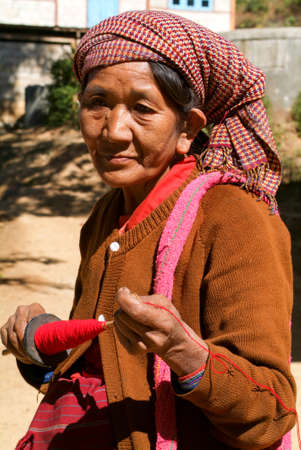 Joate (Kalaw), Myanmar - 12 January 2010: Woman with handicraft at the village of Joate on the mountains over Kalaw on Myanmarのeditorial素材