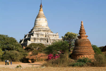 Bagan, Myanmar - 8 February 2010: People walking in front of Shwesandaw temple at the archaeological site of Baganのeditorial素材