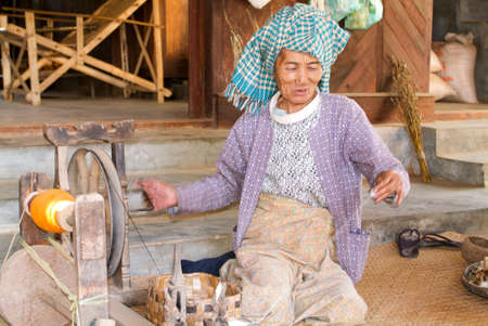 Minnanthu, Myanmar - 24 January 2010: Portrait of an old woman at the archaeological site of Bagan on Myanmarのeditorial素材