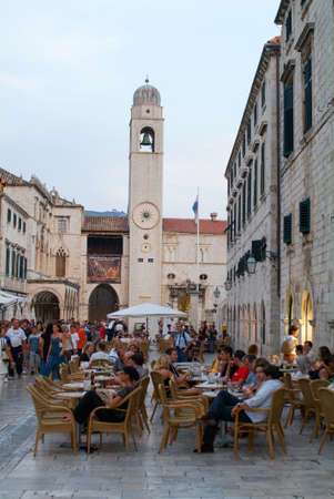 Dudrovnik, Croatia: 31 August 2004: Tourists drinking on a bar at the famous Placa street of Dubrovnik on Croatiaのeditorial素材