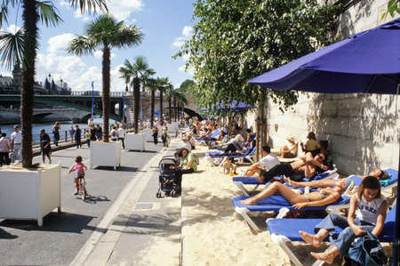 Paris, France - 2 April 2008: People sunbathing by the river Seine in Paris on Franceのeditorial素材
