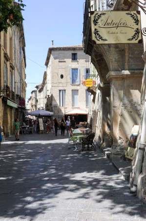 Uzes, France - 26 June 2012: People walking at the old town of Uzes on Franceのeditorial素材