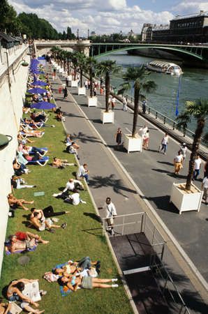 Paris, France - 2 April 2008: People sunbathing by the river Seine in Paris on Franceのeditorial素材