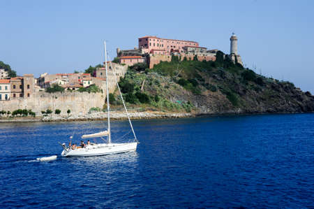 Portoferraio, Italy - 10 July 2011: Sailboat cruising in front of Portoferraio on Elba island, Italyのeditorial素材
