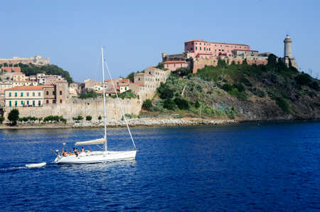 Portoferraio, Italy - 10 July 2011: Sailboat cruising in front of Portoferraio on Elba island, Italyのeditorial素材