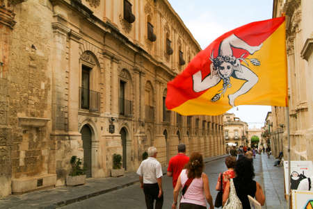 Noto, Italy - 21 July 2008: People walking on an alley of Noto in the island of Sicily, Italyのeditorial素材