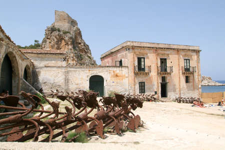 Scopello, Italy - 8 July 2008: People sunbathing in front of Tonnara at Scopello on Sicily, Italyのeditorial素材