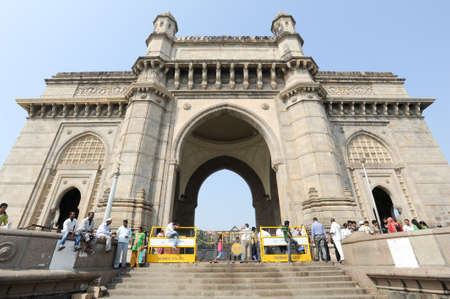 Mumbai, India - 5 january 2015: People walking and resting in front of Gateway of India at Mumbai, Indiaのeditorial素材
