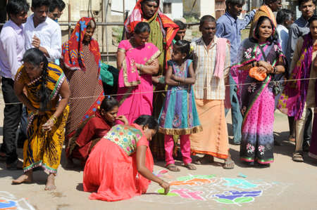 Hampi, India - 11 January 2015: Woman during a street design competition at Hampi on Indiaのeditorial素材