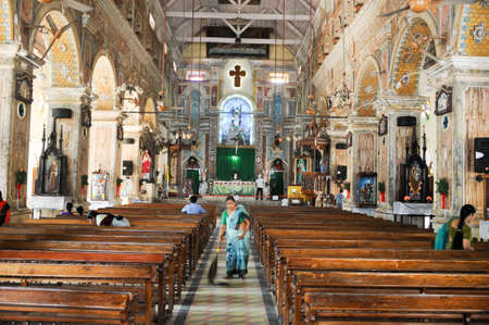 KOCHI, INDIA - JANUARY 16, 2015: People cleaning the interior of Santa Cruz Cathedral at Fort Cochin on Indiaのeditorial素材