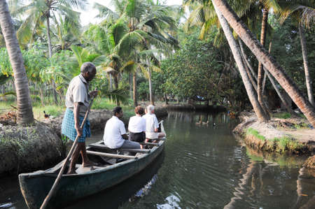 Kollam, India - 19 January 2015: Tourists cruising on a canoe a river of the backwaters at Kollam on Indiaのeditorial素材