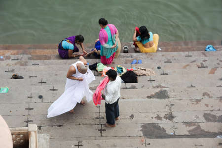 Varanasi, India - 28 January 2015: Hindu pilgrims take a holy bath in the river ganges in Varanasi or Benaresのeditorial素材