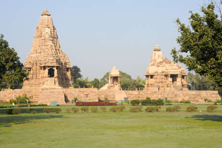 Khajuraho, India - 30 January 2015: People climb to the hindu temple on UNESCO World Heritage Site,...