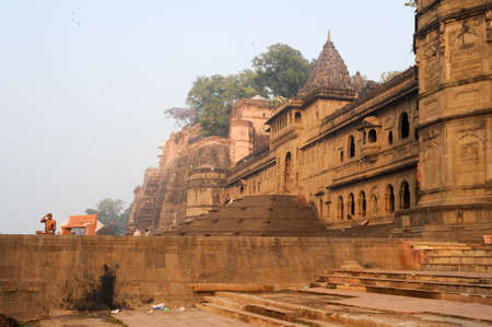 Maheshwar, India - 3 February 2015: people doing yoga and meditation in front of Maheshwar palace on Indiaのeditorial素材