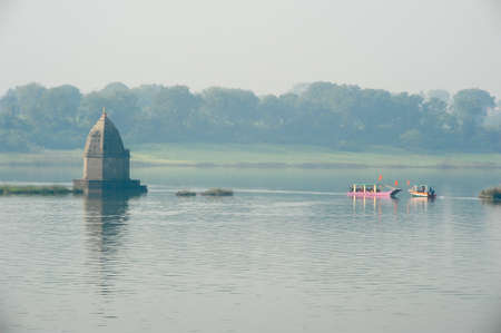 Boats on the sacred river Narmada at Maheshwar on Indiaの写真素材
