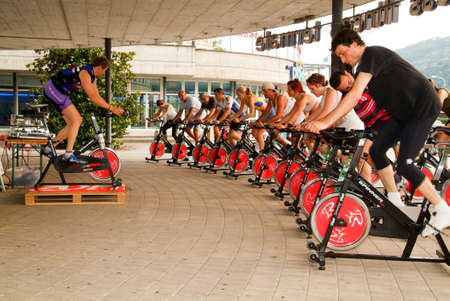 Lugano, Switzerland -17 June 2005: People pedaling during a spinning classのeditorial素材