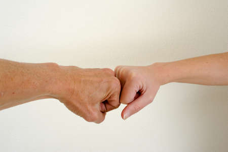Challenge of two fists of a man and a womanの写真素材