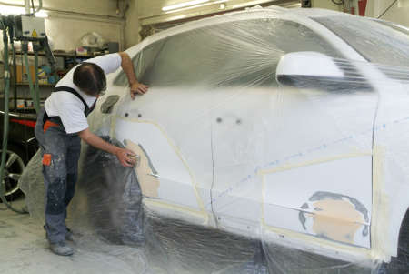 Lugano, Switzerland 25 March 2010: Mechanic reparing a car in auto repair shop.のeditorial素材