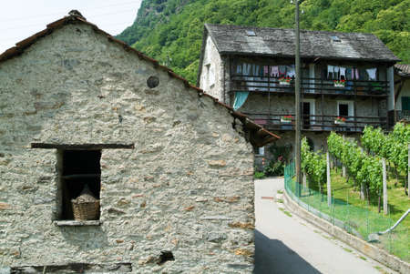 Old rural houses at the village of Lottigna on the Swiss alpsの写真素材
