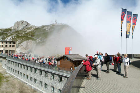Mount Pilatus, Switzerland - 23 August 2006: People visiting on walking Pilatus Kulm station near the summit of Mount Pilatus on the alps of central Switzerlandのeditorial素材