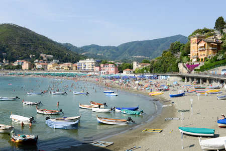 Levano, Italy - 7 July 2015: people swimming and sunbathing on the beach of Levanto in Liguria, Italyのeditorial素材