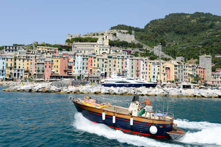 Portovenere, Italy - 7 July 2015: people navigating their boat in front of Portovenere on Italyのeditorial素材