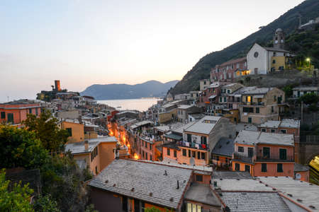 Scenic night view of village Vernazza and ocean coast in Cinque Terre, Italy