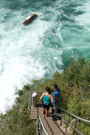 Neuhausen, Switzerland - 26 August 2008: people going up the stairs to the top of the rock that stands in the middle of the Rhine waterfalls at Neuhausen on Switzerlandのeditorial素材
