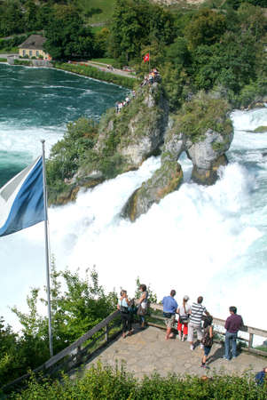 Neuhausen, Switzerland - 26 August 2008: People enjoying the view at the top of the rock that stands in the middle of the Rhine waterfalls at Neuhausen on Switzerlandのeditorial素材