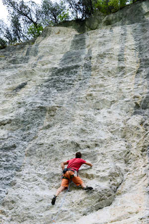 Engelberg, Switzerland - 10 August 2015: person climbing on the rock at Engelberg on the Swiss alps