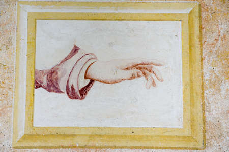 Hand on a fresco at Sacred Mount Orta on Piedmont, Italy