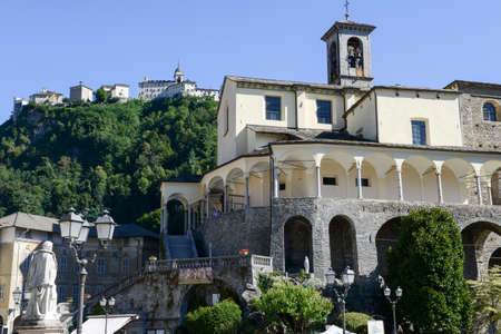 St. Gaudenzio church against blue sky, Sacred mountain sanctuary on background, Varallo Sesia village, Piedmont, Italyの写真素材