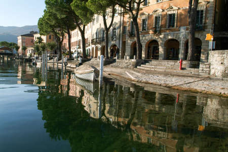 Morcote, Switzerland - 12 november 2009: People eating and drinking at restaurants in the village of Morcote on lake Lugano, Switzerlandのeditorial素材