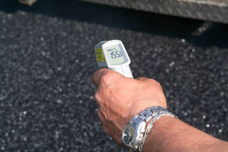 Melide, Switzerland - 8 March 2007: Workers and vehicles during the asphalting of the highway at Melide on Switzerlandのeditorial素材