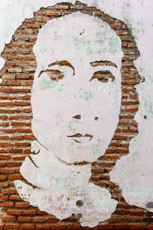 Artwork face on a brick wallのeditorial素材