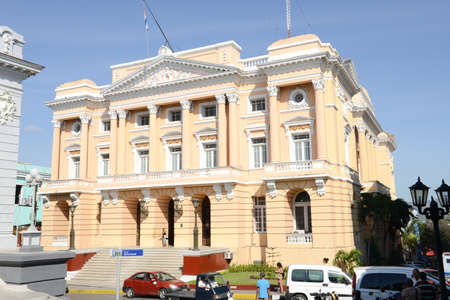Santiago de Cuba, Cuba - 13 january 2016: people walking in front of famous Provincial Palace (Palacio Provincial), old landmark of Santiago de Cubaのeditorial素材