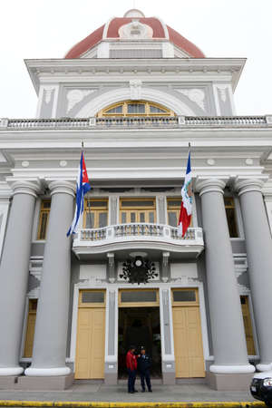 Cienfuegos, Cuba - 18 january 2016: people walking in front of the Town Hall at Cienfuegos on Cubaのeditorial素材